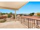 Balcony view overlooking desert landscaping with plants and trees with homes in the distance at 5010 E Mesquite Wood Ct, Phoenix, AZ 85044