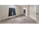 Carpeted bedroom includes a window with black-out curtains and a mirrored closet at 5010 E Mesquite Wood Ct, Phoenix, AZ 85044