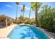 Inviting swimming pool with a large patio area, surrounded by lush landscaping at 5201 E Winchcomb Dr, Scottsdale, AZ 85254