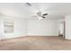 Bright and airy bedroom with ceiling fan and neutral decor at 541 W Prickly Pear Dr, Casa Grande, AZ 85122