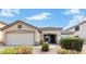 One-story house with a two-car garage and well-manicured landscaping at 541 W Prickly Pear Dr, Casa Grande, AZ 85122