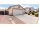 Two-car garage with a long driveway and rock landscaping at 541 W Prickly Pear Dr, Casa Grande, AZ 85122