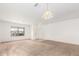 Bright living room featuring neutral walls and carpeting at 541 W Prickly Pear Dr, Casa Grande, AZ 85122