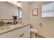 Modern bathroom with granite countertop, updated vanity, and stylish fixtures at 6073 W Caribe Ln, Glendale, AZ 85306