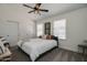 Bright bedroom with a queen-size bed, large closet, and window coverings at 6073 W Caribe Ln, Glendale, AZ 85306