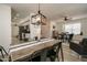 Open concept dining area with kitchen and living room access at 6073 W Caribe Ln, Glendale, AZ 85306