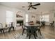 Bright dining room featuring a fireplace and a large window, creating a warm atmosphere at 6073 W Caribe Ln, Glendale, AZ 85306