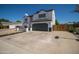 Two-story house with a gray-trimmed white exterior, a two-car garage, and a basketball hoop at 6073 W Caribe Ln, Glendale, AZ 85306