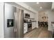 Modern kitchen with stainless steel appliances and white cabinets at 6073 W Caribe Ln, Glendale, AZ 85306