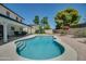 Relaxing kidney shaped pool with ample patio space for lounging at 6073 W Caribe Ln, Glendale, AZ 85306