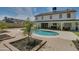 Backyard oasis with a kidney-shaped pool, patio furniture, and a covered patio at 6073 W Caribe Ln, Glendale, AZ 85306