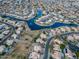 Aerial view of lakefront community with many homes at 647 S Cholla St, Gilbert, AZ 85233