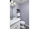 Clean bathroom with white vanity and floating shelves at 647 S Cholla St, Gilbert, AZ 85233