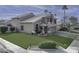 Two-story home with a well-manicured lawn at 647 S Cholla St, Gilbert, AZ 85233