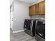 Laundry room with LG washer and dryer, and wood cabinets at 647 S Cholla St, Gilbert, AZ 85233