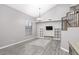 Living room with gray walls, wood-look floors, and a high ceiling at 647 S Cholla St, Gilbert, AZ 85233