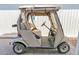 Beige golf cart parked by home exterior at 650 N Hawes Rd # 3811, Mesa, AZ 85207