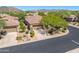 Single story home with two car garage and desert landscaping at 6970 E Hibiscus Way, Scottsdale, AZ 85266