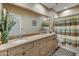 Double vanity bathroom with granite countertop at 6970 E Hibiscus Way, Scottsdale, AZ 85266