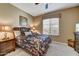 Guest bedroom with a queen-size bed and window coverings at 6970 E Hibiscus Way, Scottsdale, AZ 85266