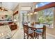 Bright breakfast nook with a table and chairs, offering views of the backyard at 6970 E Hibiscus Way, Scottsdale, AZ 85266