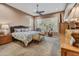 Large main bedroom with ceiling fan, plush carpet, and ample natural light at 6970 E Hibiscus Way, Scottsdale, AZ 85266