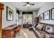 Home office with built-in shelving and leather sofa at 6970 E Hibiscus Way, Scottsdale, AZ 85266