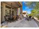 Spacious covered patio with seating area, perfect for outdoor dining and relaxation at 6970 E Hibiscus Way, Scottsdale, AZ 85266