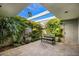 Private courtyard with seating area, fountain, and lush greenery at 7420 N San Manuel Rd, Scottsdale, AZ 85258