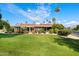 Single story home with tile roof and manicured lawn at 7420 N San Manuel Rd, Scottsdale, AZ 85258