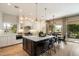 Spacious kitchen with island, white cabinets, and stainless steel appliances at 7420 N San Manuel Rd, Scottsdale, AZ 85258