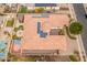 Bird's-eye view showcasing home's layout, pool, and solar panels at 7556 W Crystal Rd, Glendale, AZ 85308