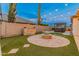 Expansive backyard with fire pit and spa at 7556 W Crystal Rd, Glendale, AZ 85308