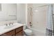 Bathroom with shower, vanity, and patterned curtain at 7556 W Crystal Rd, Glendale, AZ 85308