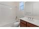 Bathroom with tub, vanity, and updated fixtures at 7556 W Crystal Rd, Glendale, AZ 85308