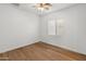 Bright bedroom with wood-look floors and ceiling fan at 7556 W Crystal Rd, Glendale, AZ 85308