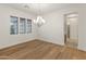 Bright dining room featuring hardwood floors and chandelier at 7556 W Crystal Rd, Glendale, AZ 85308