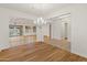 Bright dining room with hardwood floors and a chandelier at 7556 W Crystal Rd, Glendale, AZ 85308