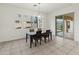 Dining room with table and chairs and sliding door to backyard access at 7556 W Crystal Rd, Glendale, AZ 85308