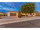 Attractive single-story home with a two-car garage and manicured landscaping at 7556 W Crystal Rd, Glendale, AZ 85308