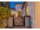 Ornate front gate leading to the main entrance of the home at 7556 W Crystal Rd, Glendale, AZ 85308