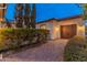 Two-car garage with brick pavers and landscaping at 7556 W Crystal Rd, Glendale, AZ 85308