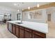 Modern kitchen with large island and stainless steel appliances at 7556 W Crystal Rd, Glendale, AZ 85308