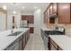 Modern kitchen with large island and stainless steel appliances at 7556 W Crystal Rd, Glendale, AZ 85308