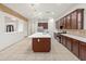 Modern kitchen with large island and stainless steel appliances at 7556 W Crystal Rd, Glendale, AZ 85308