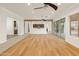 Open living room with kitchen view and sliding glass doors at 7556 W Crystal Rd, Glendale, AZ 85308