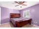 Main bedroom with large bed and purple walls at 8055 S 7Th St, Phoenix, AZ 85042