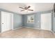 Simple bedroom with tile floors and ceiling fan at 8055 S 7Th St, Phoenix, AZ 85042