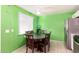 Dining area with a round table and green walls at 8055 S 7Th St, Phoenix, AZ 85042