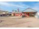 Red house exterior with carport and gravel driveway at 8055 S 7Th St, Phoenix, AZ 85042